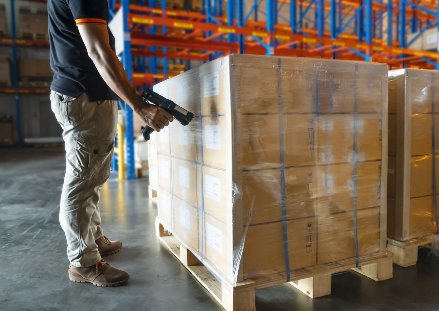 warehouse worker using barcode inventory systems