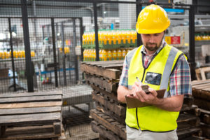 Worker taking warehouse delivery