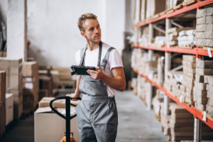 Warehouse worker picking stock in warehouse